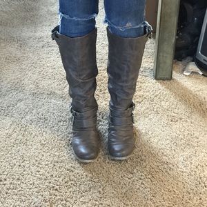 Carlos Santana knee high boots.