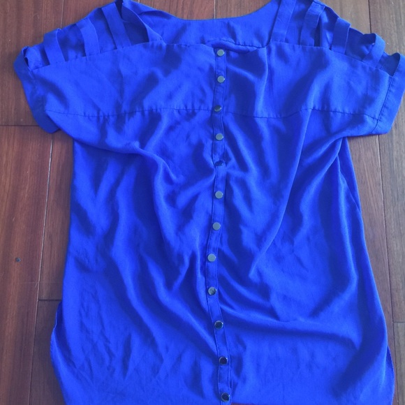Blue cut out blouse.