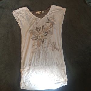 White and tan top with flower designs