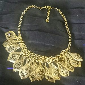 Antique look gold tone necklace.