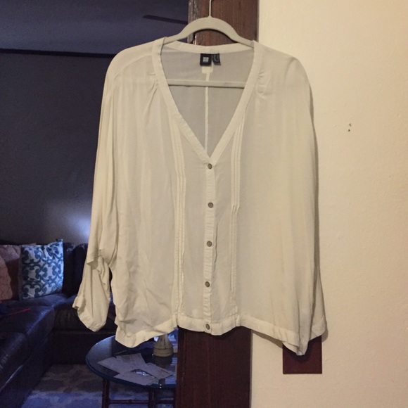 cream colored long sleeve shirt
