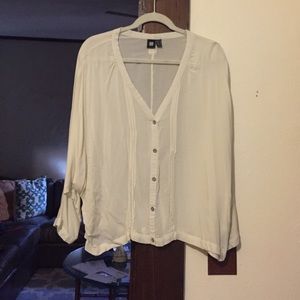 cream colored long sleeve shirt