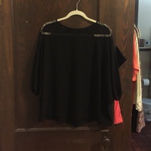 a black quarter sleeve top
