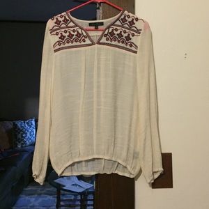 cream colored long sleeve top