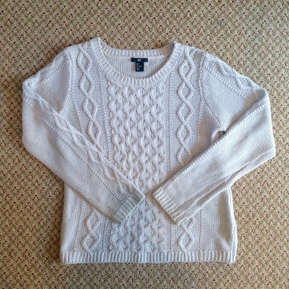 tan cable-knit sweater