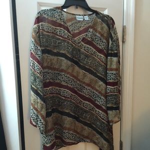 Multi print silk tunic that is long on the sides.