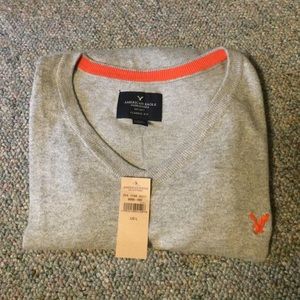 men's grey and orange sweater