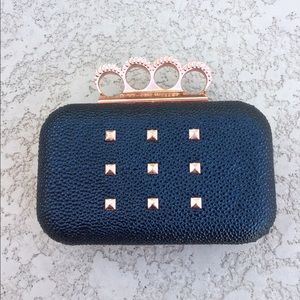 RIHANNA BLACK AND ROSE GOLD CLUTCH
