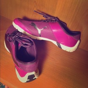 Purple and white Puma running shoes