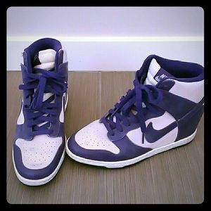 Purple Nike high top wedged sneakers.