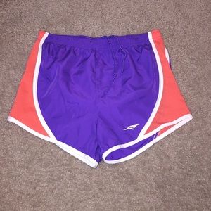 Purple, orange and white running shorts.