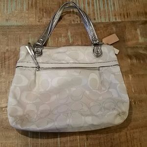 White and silver Coach purse