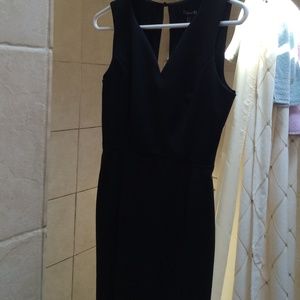 Knee length black dress.