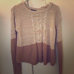 brown and cream colored knitted sweater