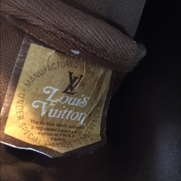 Tag in Louis Vuitton bag. Does this help, dear?
