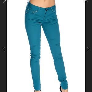 Bright teal "super skinny" jeans