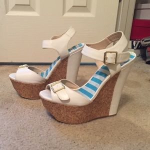 White wedges with cork bottom. Gold buckle