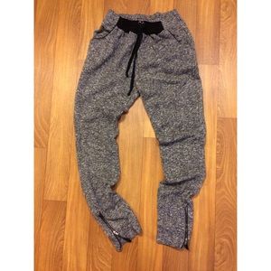 Grey joggers with zipper at bottom