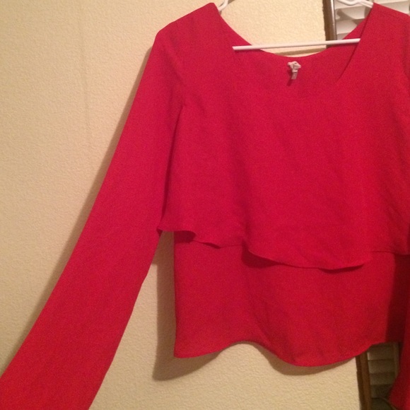 Red long sleeve, open back shirt