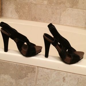 Black with white stitches . Cork soles.