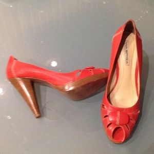 Coral shoes. All leather. White stitching.