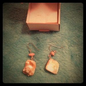 Cream color stone earrings.