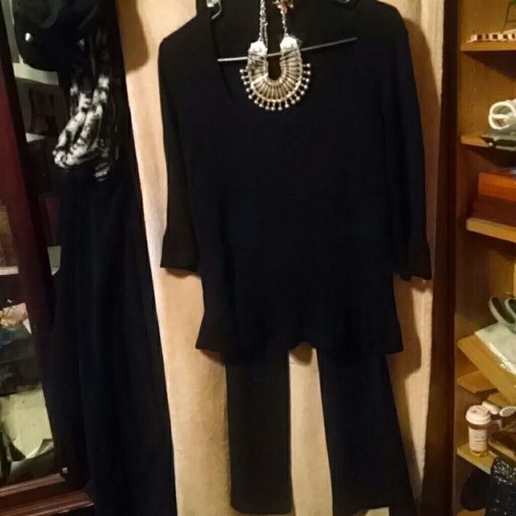 Black top and pants outfit.