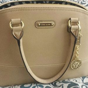 Tan/cream colored Anne Klein purse.