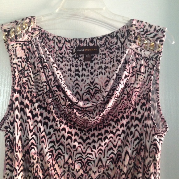 Pink and black sleeveless blouse.