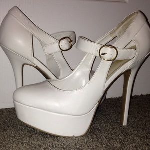 While heels with gold buckle