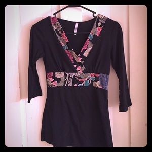 Beautiful black top with flower design.