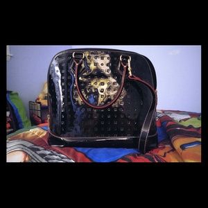 Arcadia patent leather large dome satchel.