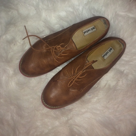 brown oxfords with red bottoms