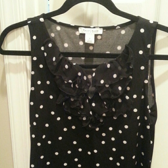 Sleeveless black with white polka dot shirt