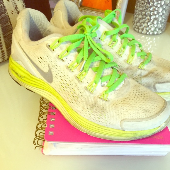 White Nike shoes with neon green