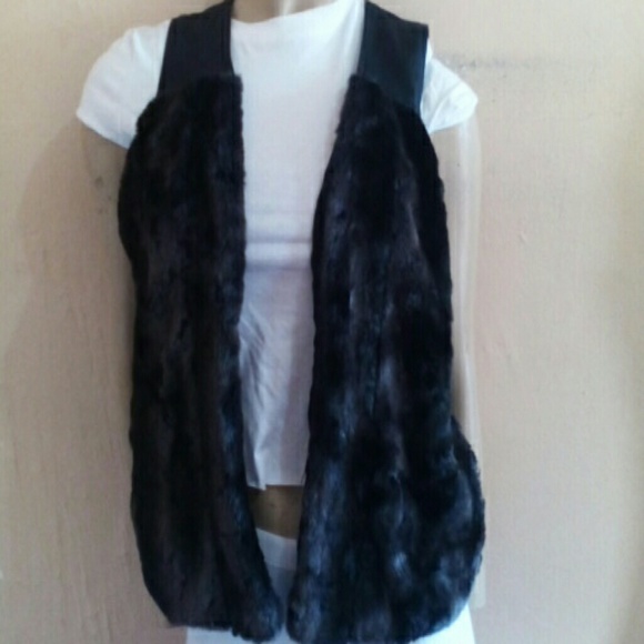 Faux fur and fake leather vest.... NWOT