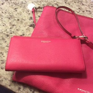 Coach pink leather wallet.