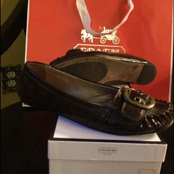 Brown patent leather coach flat
