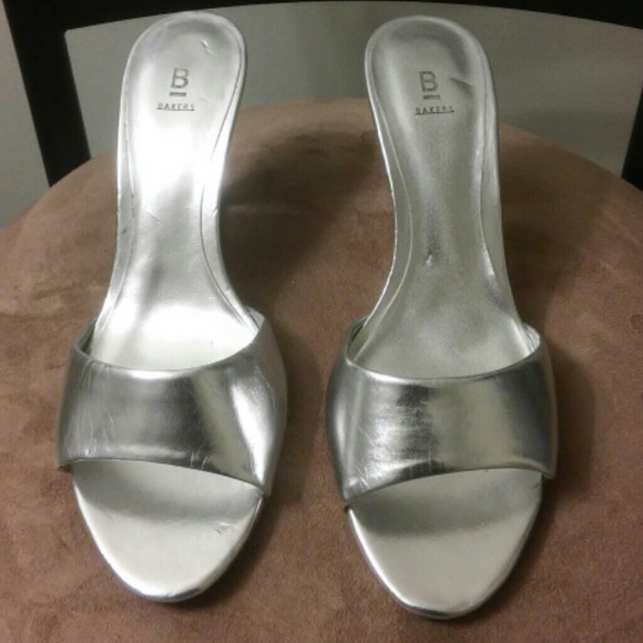 Silver wedges with clear heel.