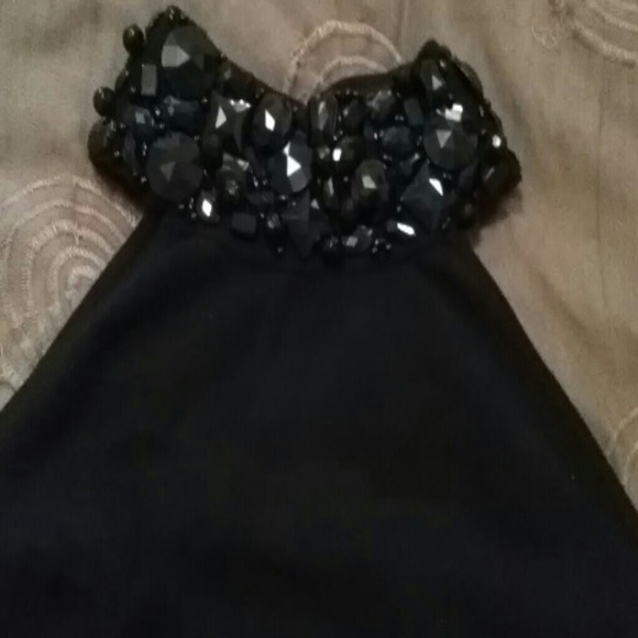 Sleeveless black sweater