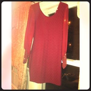 A beautiful red dress worn once.