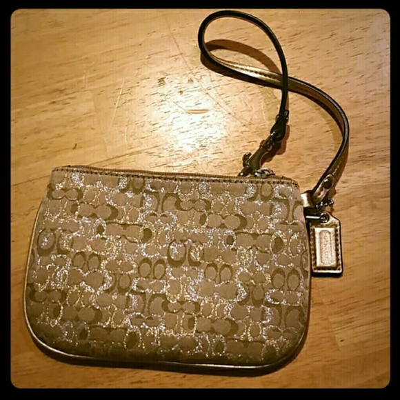 Authentic gold coach wristlet