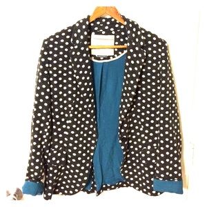Gray blazer with white polka dots.