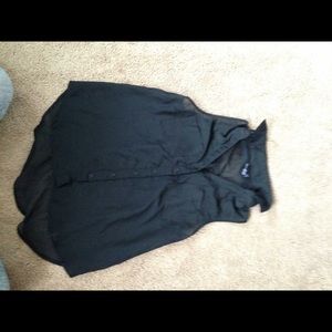 Black sleeveless top.