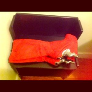 Hot orange knee boots with chrome heal