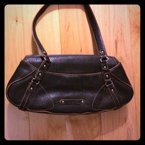 Cole Haan black leather purse with brown piping