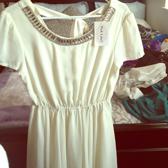 A creamy white dress with a jeweled neckline 💕