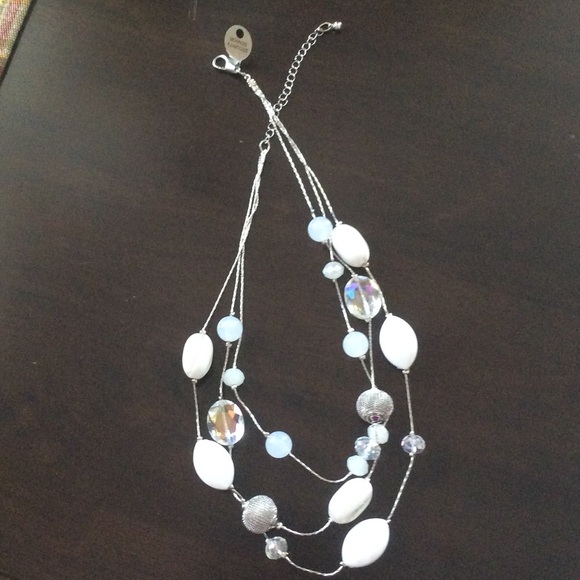 Triple strand silver and white necklace.