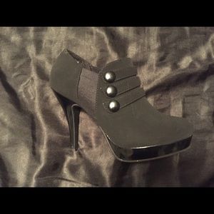 Black booty heels with button embellishment