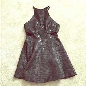 Black Fit and Flare mini ASTR cutout dress.